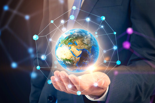 Man holding Earth with network