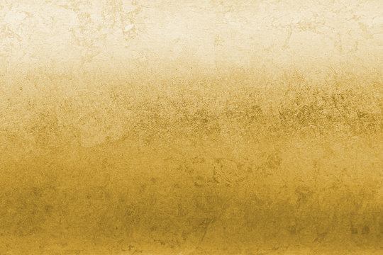 Gold foil leaf shiny wrapping paper texture background for wall paper decoration element