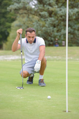 Golfer assessing next shot