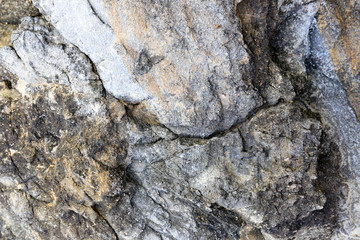 Rock texture and surface background. Cracked and weathered natural stone background.