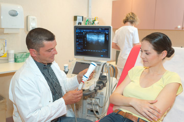gynecologist doctor checking a pregnant woman at hospital