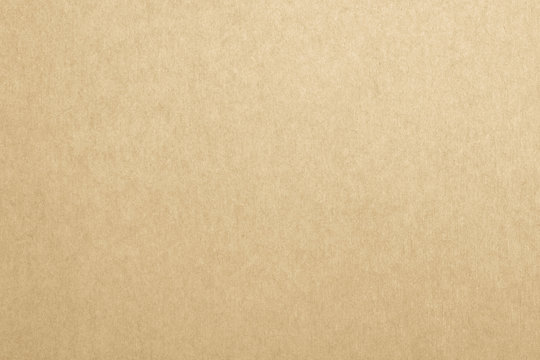 Recycled paper texture background in brown yellow cream color tone.