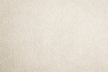 Recycled paper texture background in cream beige color
