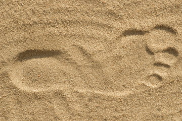 Fototapeta na wymiar foot print on sand