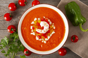 Soup gazpacho. Italian cuisine. Plate with soup in a white plate on a rustic background. Top Vieux.