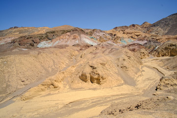 Fototapeta na wymiar Colorful rock formations in the desert under a blue sky