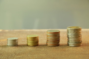 Thai coin with different size arranging on wooden board