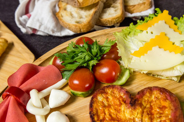 Close up of  traditional Turkish breakfast served with cheese, salami, tomato, cucumber and toasted bread