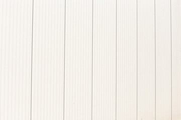 Obraz premium Continuous vertical straight lines pattern Factory wall made of metal sheet Aluminum wall texture background and cement floor with space.Empty for product display. Soft focus, conceptual design 