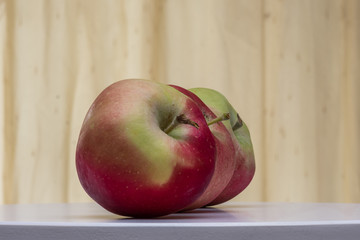 Autumn fruits, apples on wooden table. 