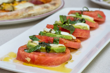 Delicious salad with white cheese and tomatoes 