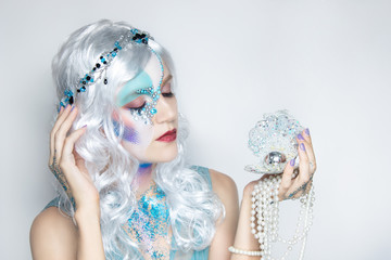 Beautiful mermaid girl in white wig