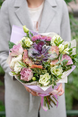 Beautiful spring bouquet. Arrangement with mix flowers. The concept of a flower shop, a small family business.