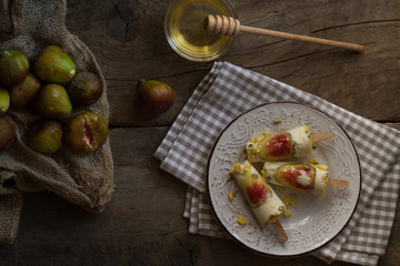 Ice cream pops made with fresh figs. Summer refreshment. Homemade healthy dessert. Rustic. Flat lay