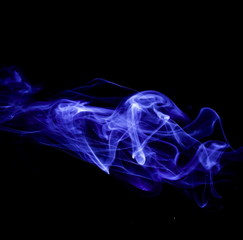 Fototapeta premium Blue smoke on black background