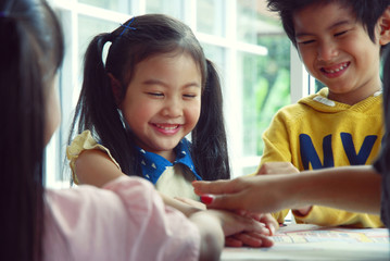 Children are enjoying painting with Teachers in summer holiday.