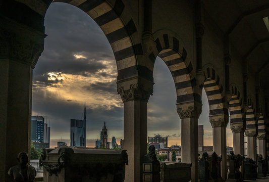 milano skyline view in a cloudy day with epic sky from the monumental cemetery