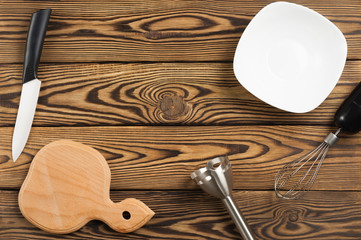 Kitchen equipment on old worn brown table. Top view with copy space