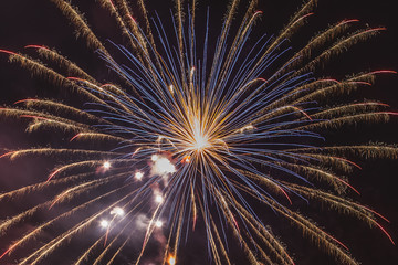 Gold and blue fireworks on the feast of the patron saint of the city, Vittorio Veneto, Italy