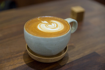 Coffee on wood table in coffee shop