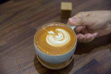 Coffee on wood table in coffee shop