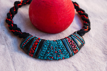 Handmade jewelry. Traditional tibetan turquoise, black and red bib necklace from polymer clay.