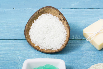 beauty product samples from grape seed ingredient, blue wooden table background, soft light