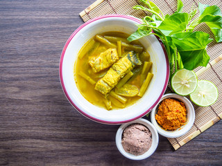 Southern Thai  food, Spicy Sour Yellow Curry with Sea Bass and Thai Water Spinach, Sour soup made of Bilimbing and lime juice .