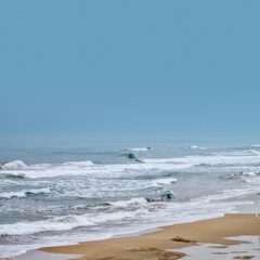 seascape image of stormy weather on beach