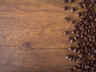Coffee beans on wood background