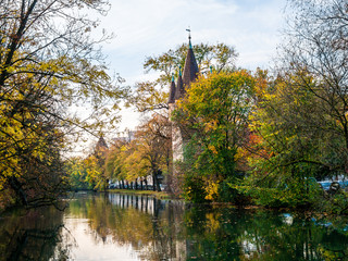 View on tower in Augsburg during autumn with water reflections