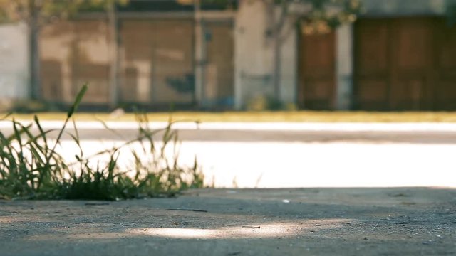 Boys Kicking the Ball On the Sidewalk.