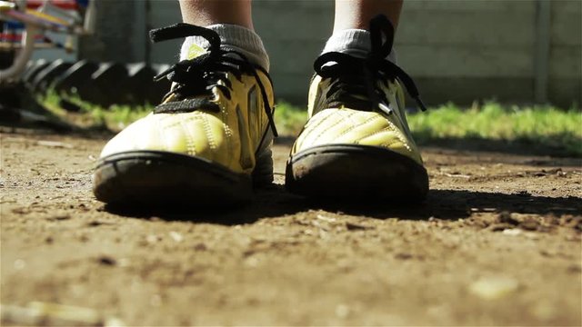 Boy Doing a Long Jump in the Yard.