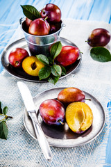Plums on wooden table 