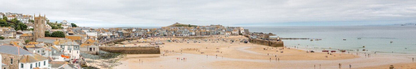 Obraz premium Landscape Panorama of St Ives Harbour at low tide West Cornwall South England UK