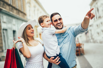 Happy family having fun outdoor after shopping