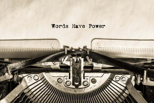 an inscription printed on a vintage typewriter on a piece of paper Words Have Power. writer, journalist. office.