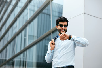 Business Man Standing Near Office Center