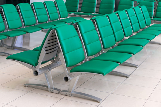 Row Of Green Chair At Airport Terminal Waiting Area