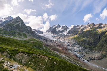 Fototapeta na wymiar Glacier Snow Melting into a Stream in Iconic Mont-Blanc Mountain Range.