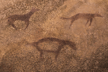 images of ancient animals on the wall of the cave. ancient art. history, archeology.