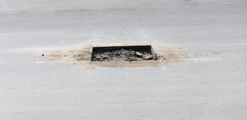 bad asphalt road, repair of asphalt road,  pit on the road