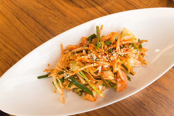 Kimchi made with bunching onion and bean sprouts, is a traditional fermented Korean side dish made of vegetables with a variety of seasonings (Pa Kimchi)