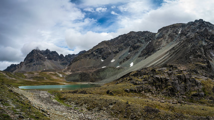 Fototapeta na wymiar Green lake in old glacier near Denali