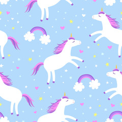 Fototapeta na wymiar Cute cartoon colorful seamless pattern with white unicorns rainbows and stars on blue background. Perfect for kids textile, wallpaper, wrapping paper etc. Vector illustration