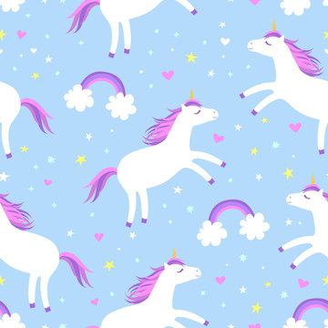 Cute cartoon colorful seamless pattern with white unicorns rainbows and stars on blue background. Perfect for kids textile, wallpaper, wrapping paper etc. Vector illustration