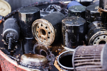 group of old oil filters of the car with a shallow depth of field