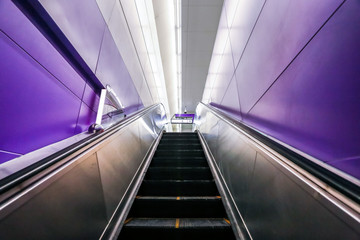 Obraz premium Escalator in the city leading to the underground passage of the subway