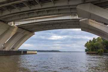Below the Woodrow Wilson Memorial Bridge, which spans the Potomac River between Alexandria,...