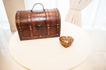 holiday concept,  vintage small chest with a secret stands next to the roving-looking heart